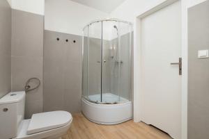 Family Apartment in Łódź with Balcony Close to the Park by Noclegi Renters