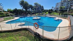 Condo with Pool & Mediterranean Views
