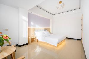 外滩之家酒店 The Bund House Hotel 近老挝国家主席府凯旋门店