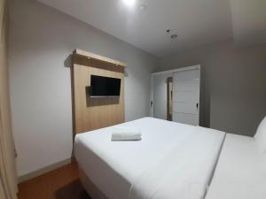 Elegant and Spacious 1BR at Patraland Amarta Apartment By Travelio
