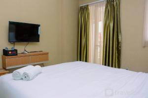Cozy and Modern Signature Park Grande Studio Apartment By Travelio