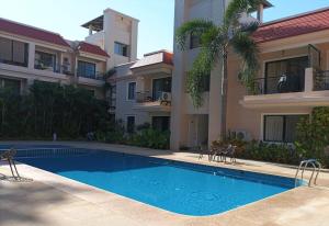 Magnolia elegant One BHK pool gym WiFi 10 mins to Beach