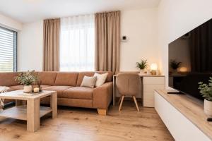 ALURE RESIDENCES 9 & 24h self check-in, private parking in front of the apartment building included, new building, terrace, the apartment building has its own park with a lake and outdoor fitness, childrens playground, CITY CENTER