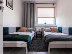 Quadratum Apartment by Noclegi Renters