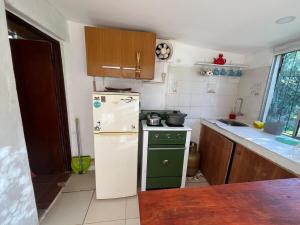 A bright little house in a central location with a wood-burning stove