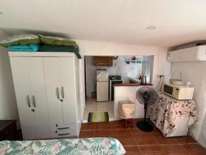 A bright little house in a central location with a wood-burning stove