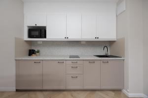 Pileckiego Apartments with Parking & Balcony by Noclegi Renters