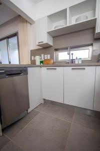 Stylish New 2-Bedroom Apartment with Pools & Gym