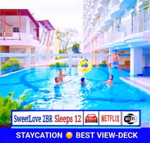 SweetLove HideAway 2-Bedroom Suite in CITYLAND Condo with 2-Bath, Living room, Balcony, Kitchen, Free Pool, 2-Parking, Netflix