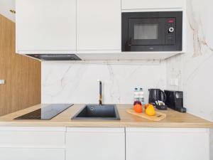 Modern Space Premium Studio with Balcony & AC by Solarento