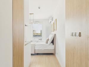 Modern Space Premium Studio with Balcony & AC by Solarento