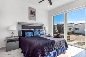 Dog-friendly retreat with ocean-view rooftop deck, pool, hot tub, & kitchen