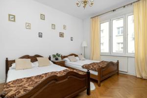 Czarujący Apartament z Sypialnią by Noclegi Renters