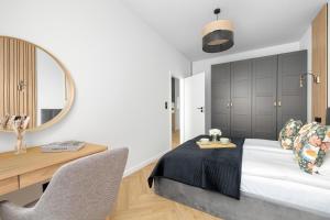 Funkcjonalne Apartamenty z Klimatyzacją i Miejscem do Pracy by Noclegi Renters