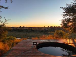 Camp Naledi - Exclusive Safari Tented Lodge with River View I Full Board I Natural Plunge Pools I Free WiFi
