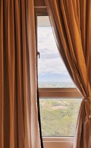 Studio 15 & 19 Cozy Staycation at Mesavirre Garden Residences