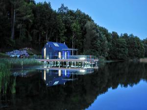 Holiday home with private lake and beach