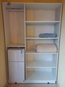 Mi Hábitat Lambaré - Habitaciones con Baño Privado, Cocina y Comedor equipados con electrodomésticos, con Quincho al Aire Libre