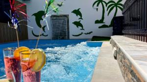 Villas Puerto Rico in front of the shopping center with private heated saltwater pool with jacuzzi function & arcade games