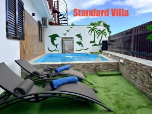 Villas Puerto Rico in front of the shopping center with private heated saltwater pool with jacuzzi function & arcade games