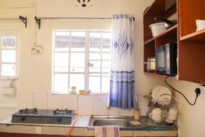 Charis Stays - Cozy 1BR Near ELD CBD