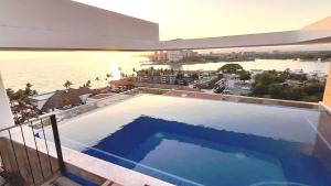 1BR Apartment with Pool and Sunset Views
