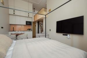 Cosy Studio with Mezzanine Centre of Warsaw by Noclegi Renters