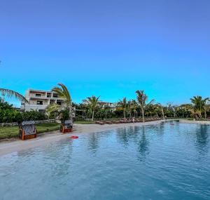 Your peaceful getaway at Paje Beach in a one-bedroom flat with large terrace and pool