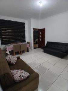 Pé na areia katia medalha