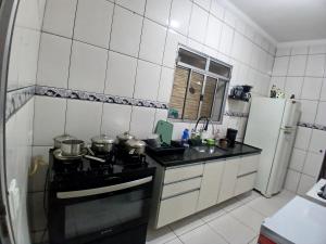 Pé na areia katia medalha