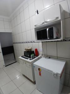 Pé na areia katia medalha