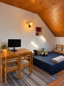 Cozy Attic Apartment with Private Balcony & BBQ