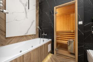 Przestronny Apartament z Sauną i Tarasem by Noclegi Renters