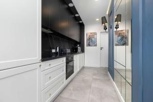 Przestronny Apartament z Sauną i Tarasem by Noclegi Renters
