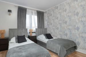 Przestronny Apartament w Centrum Kielc z Parkingiem by Noclegi Renters