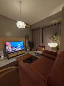 2BR Near Airport, 300m to MOA Arena Free Pool w Balcony
