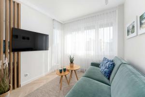 Przytulny Apartament Niedaleko Plaży i Centrum Kołobrzegu by Heyrent