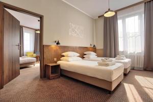 Classic Quadruple Room with City View room in Daniel Griffin Aparthotel by Artery Hotels