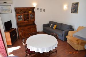 Apartment PALATISA on the beach with sunbeds, umbrella and canoe