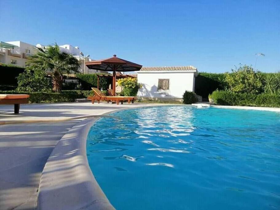 One room in a compound with the swimming pool Images
