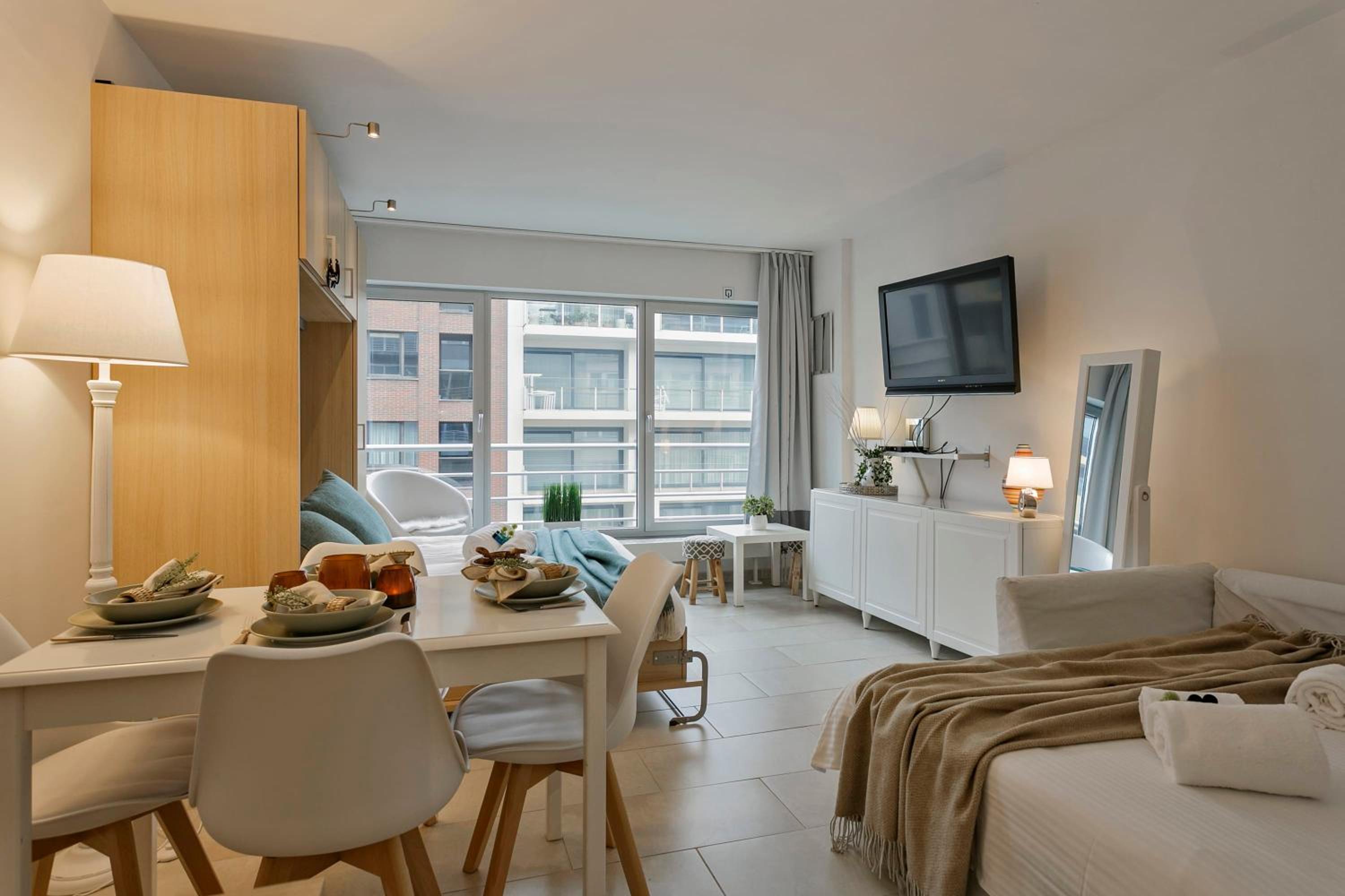 Modern yet very cosy and sunny flat, with the beach right around the corner Images