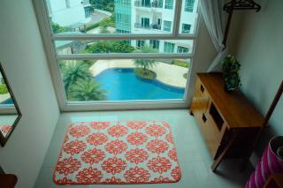 1BR Apartment Woodland Park Residence Kalibata View Swimming Pool By Travelio - 1