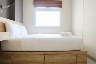 Modern and Bright 2BR Green Pramuka Apartment By Travelio - 9