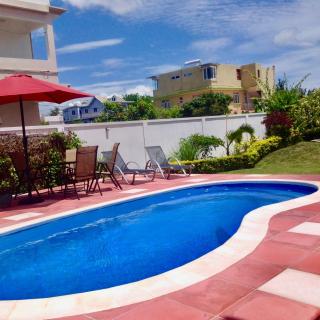 Cardamon Villa is a 2 bedroom with 1 bathroom and seperate toilet detached house with AC and swimming pool , 5 minutes walk from Flic en Flac public beach - 0