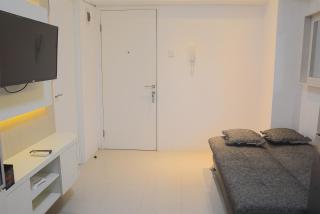 Pool View 2BR with Sofa Bed Bassura City Apartment By Travelio - 7