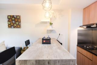 Modern and Bright 2BR Springlake Apartment By Travelio - Bekasi - 3