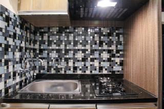 Minimalist and Comfy 1BR Grand Kamala Lagoon Apartment By Travelio - 1