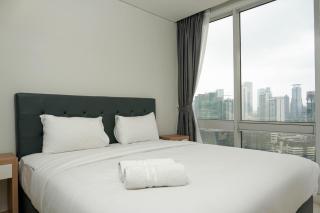 Comfortable Deluxe 2BR at The Empyreal Condominium Epicentrum Apartment By Travelio - 0