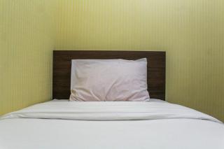 Comfortable and Tranquil 2BR Apartment at Green Pramuka By Travelio - 1