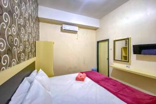 Tini's Guest House Malang Mitra RedDoorz - Betek - 4